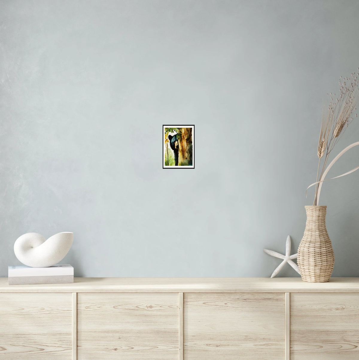 Black Bear Peeking from Behind a Tree in Fall - small 8 x 10 matted and framed art print shown hanging on a wall