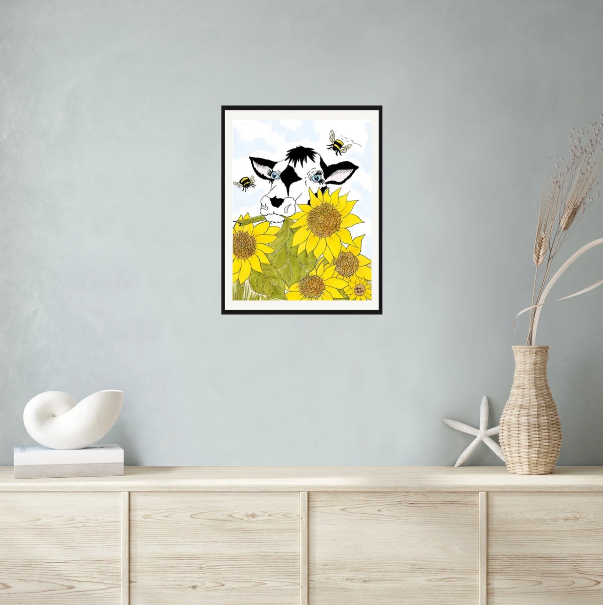 Bella Cow Among Sunflowers - large 24 x 36 matted and framed art print shown hanging on a wall