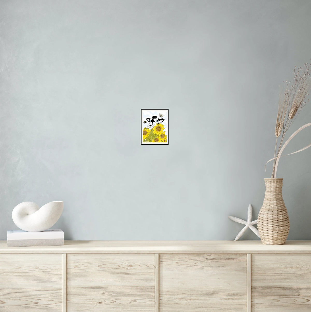Bella Cow Among Sunflowers - small 8 x 10 matted and framed art print shown hanging on a wall