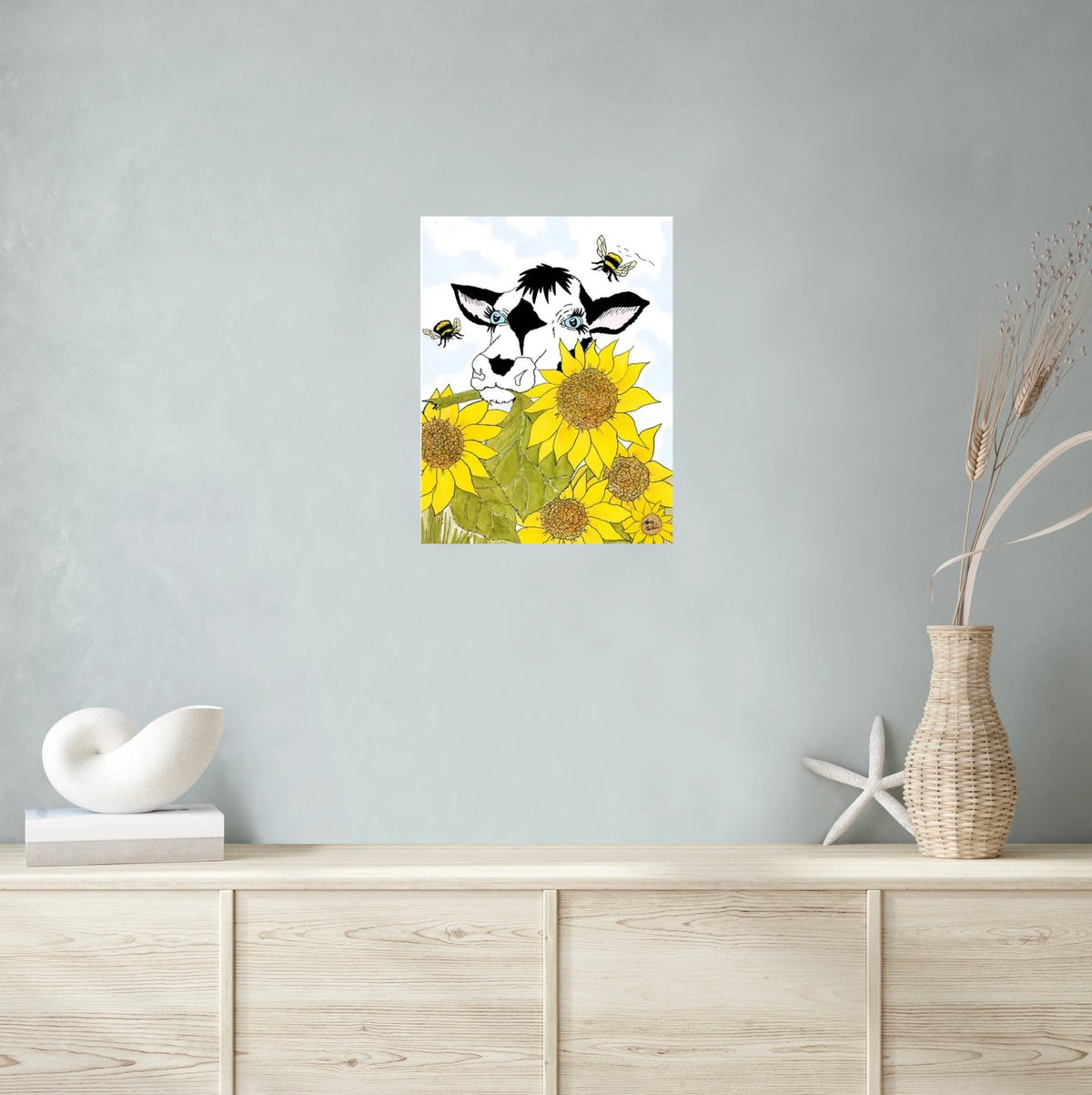 Bella Cow Among Sunflowers - large 24 x 36 unframed art print shown hanging on a wall