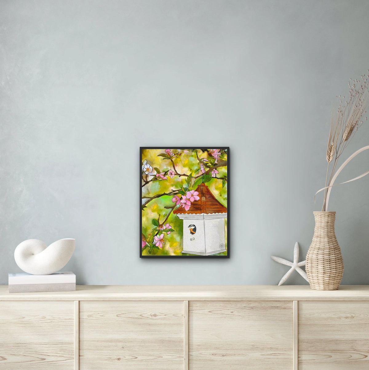 Cherry Blossoms and Birdhouse - large 24 x 36 framed art print shown hanging on a wall