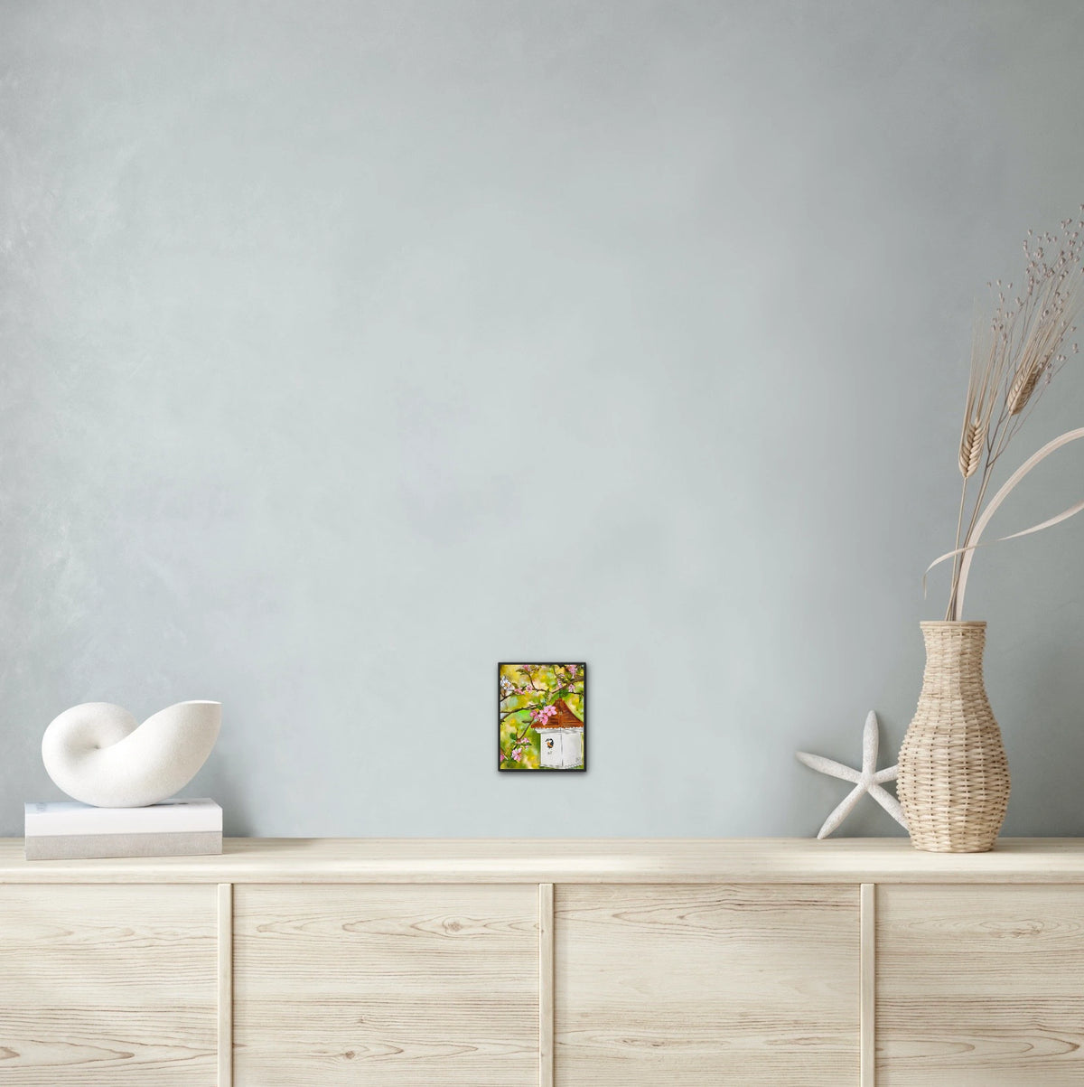 Cherry Blossoms and Birdhouse - small 8 x 10 framed art print shown hanging on a wall