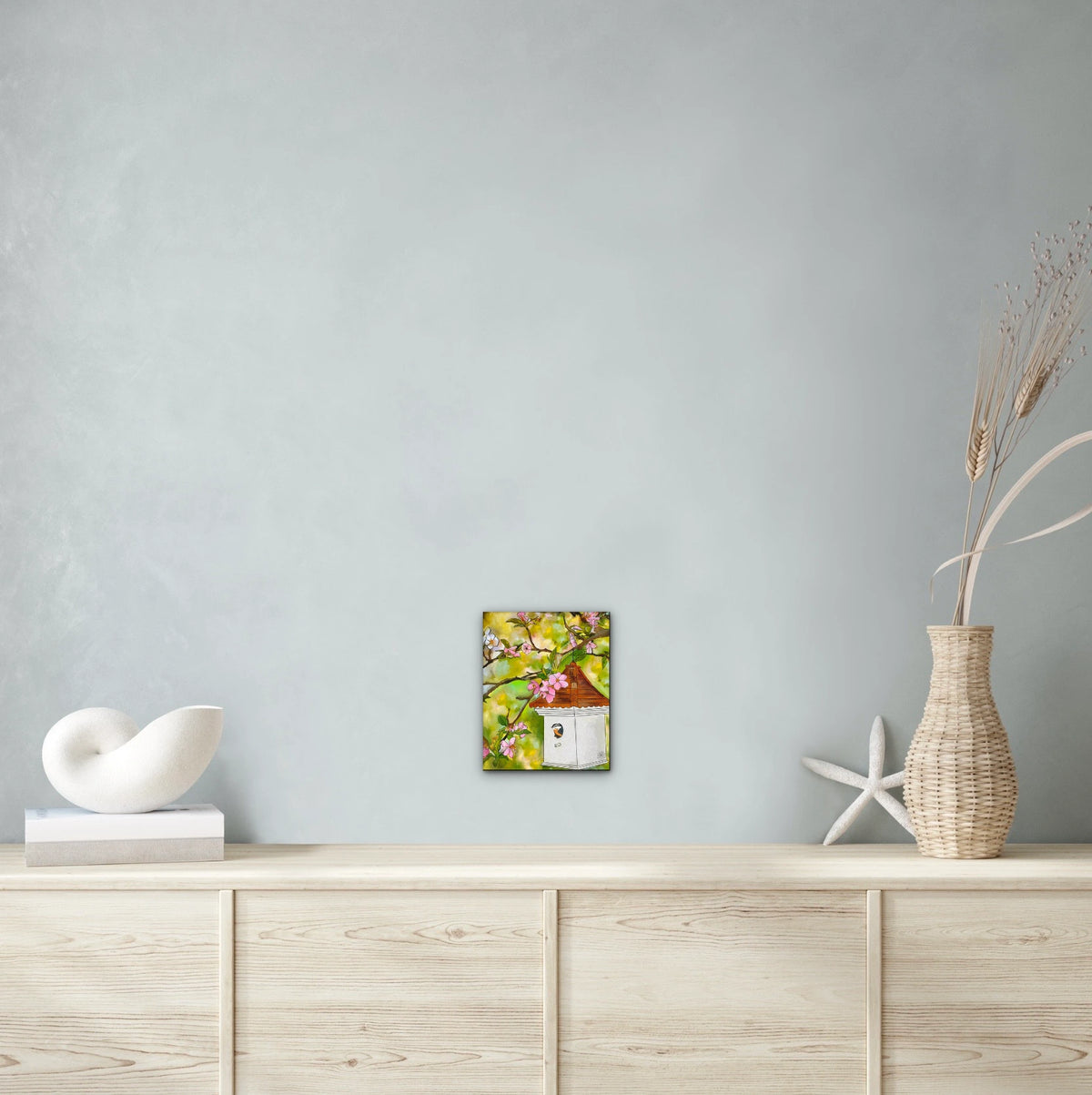 Cherry Blossoms and Birdhouse - medium 12 x 16 unframed art print shown hanging on a wall
