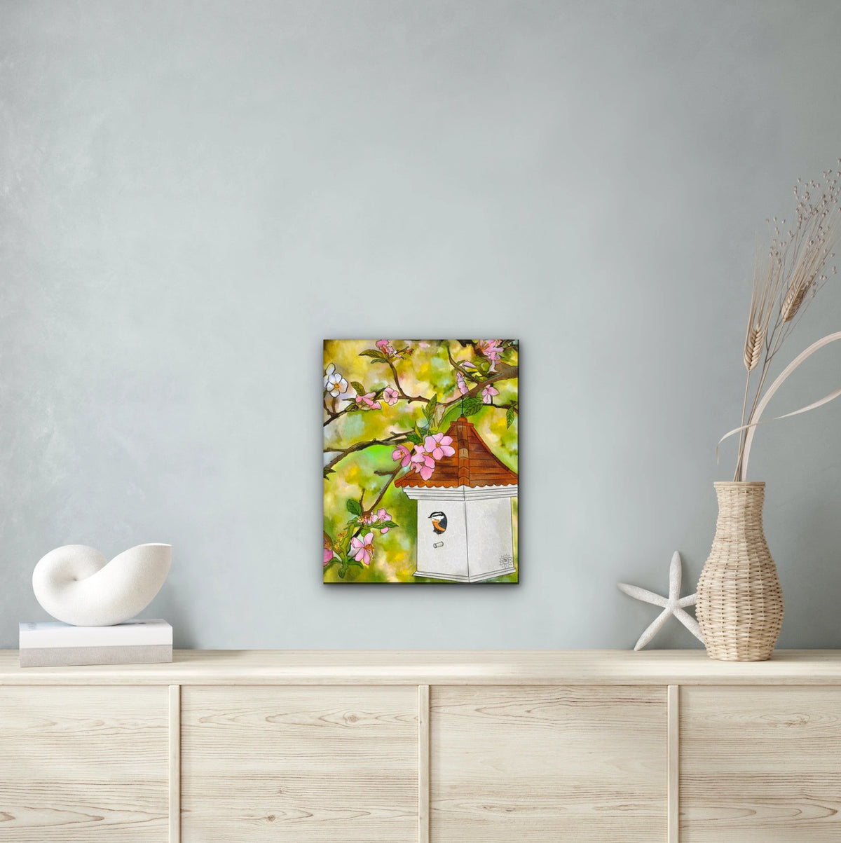 Cherry Blossoms and Birdhouse - large 24 x 36 unframed art print shown hanging on a wall