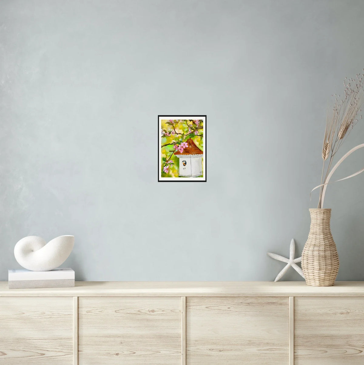 Cherry Blossoms and Birdhouse - medium 12 x 16 matted and framed art print shown hanging on a wall