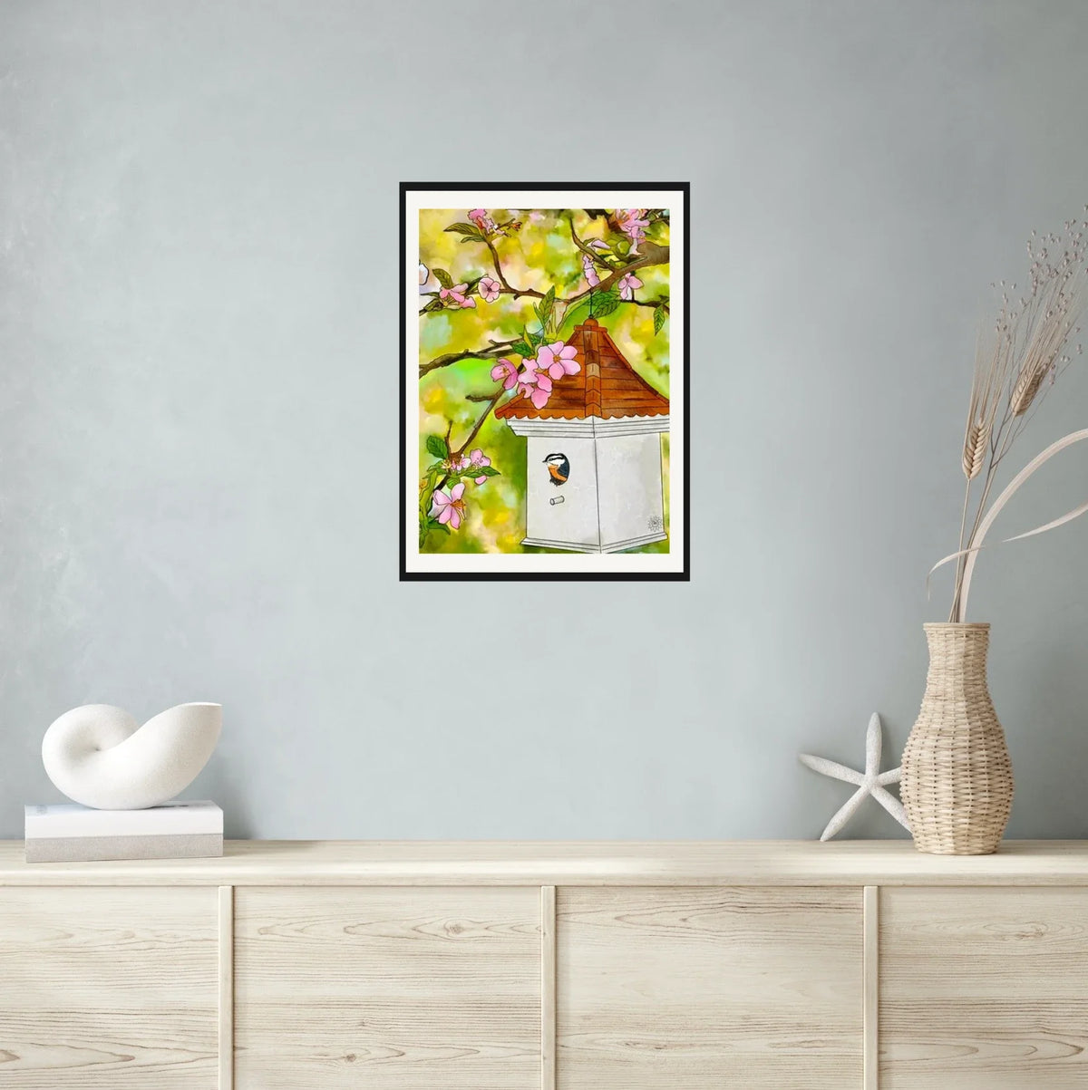 Cherry Blossoms and Birdhouse - large 24 x 36 matted and framed art print shown hanging on a wall