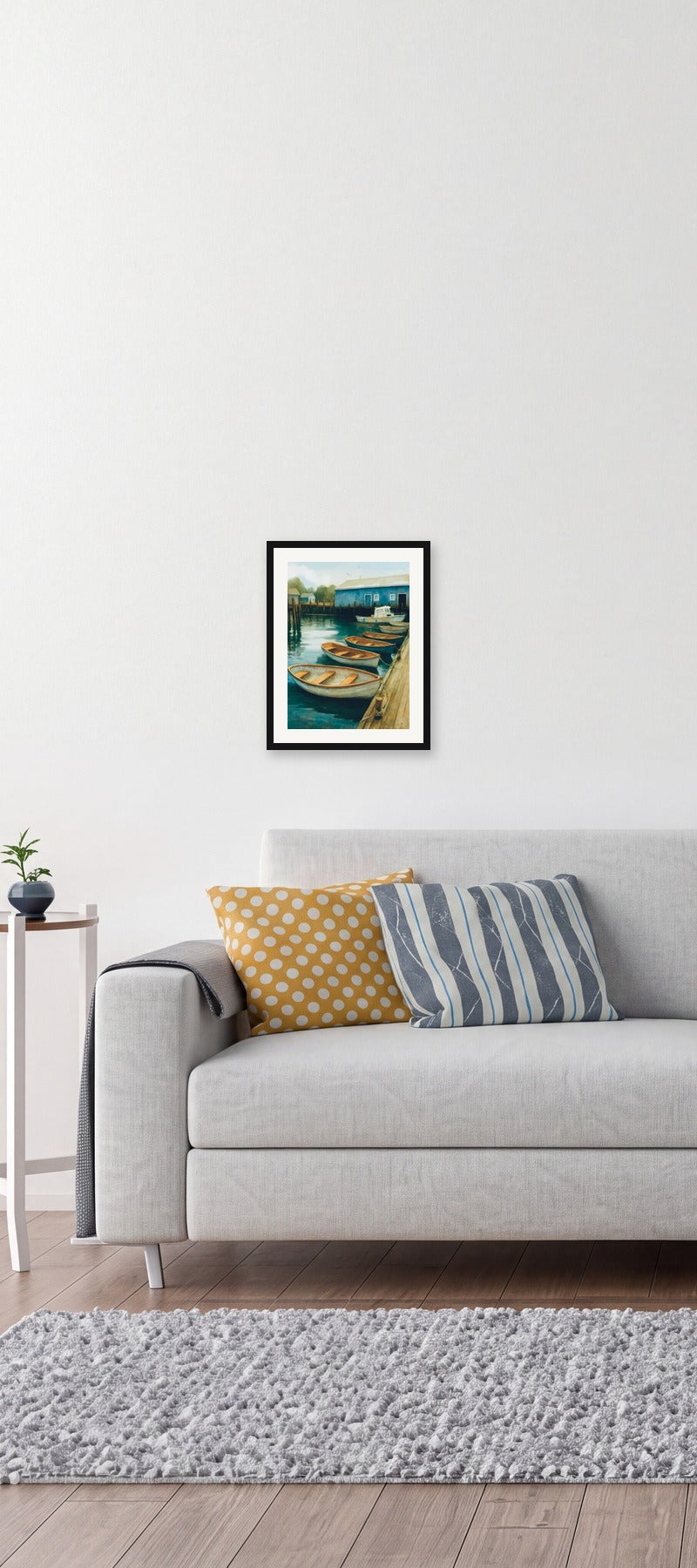 This is a medium 12 x 16 matted and framed watercolor art print of wooden dories tied along a working dock beside a blue harbour shed. Created by professional artists, this high-quality watercolor print on textured matte paper adds a touch of character to any home or office decor.