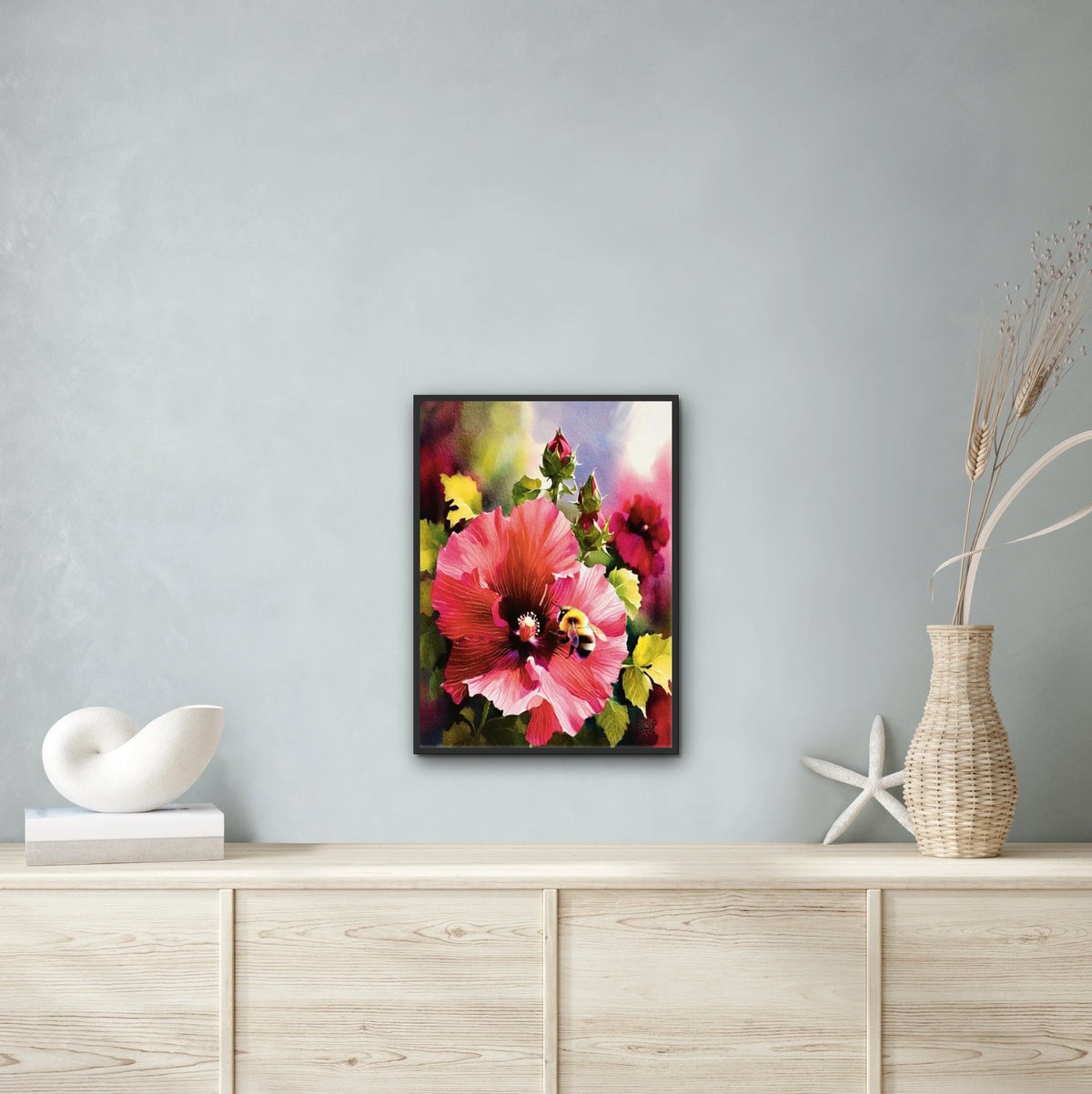 Red Hollyhock with Bee - large 24 x 36 framed art print shown hanging on a wall