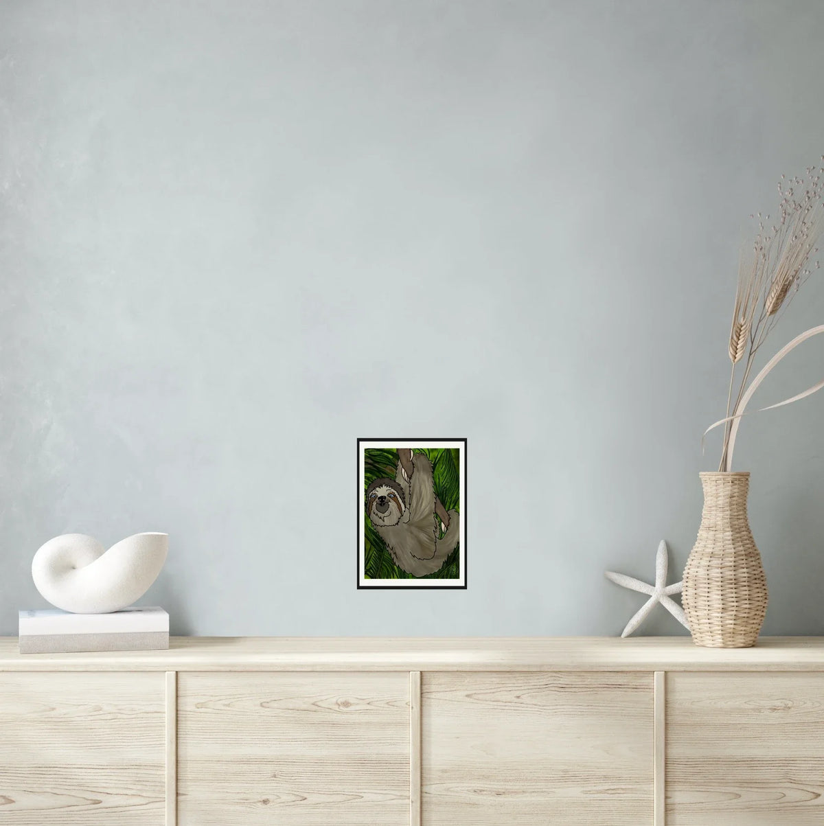 Winifred Sloth - Hanging in There - medium 12 x 16 matted and framed art print shown hanging on a wall